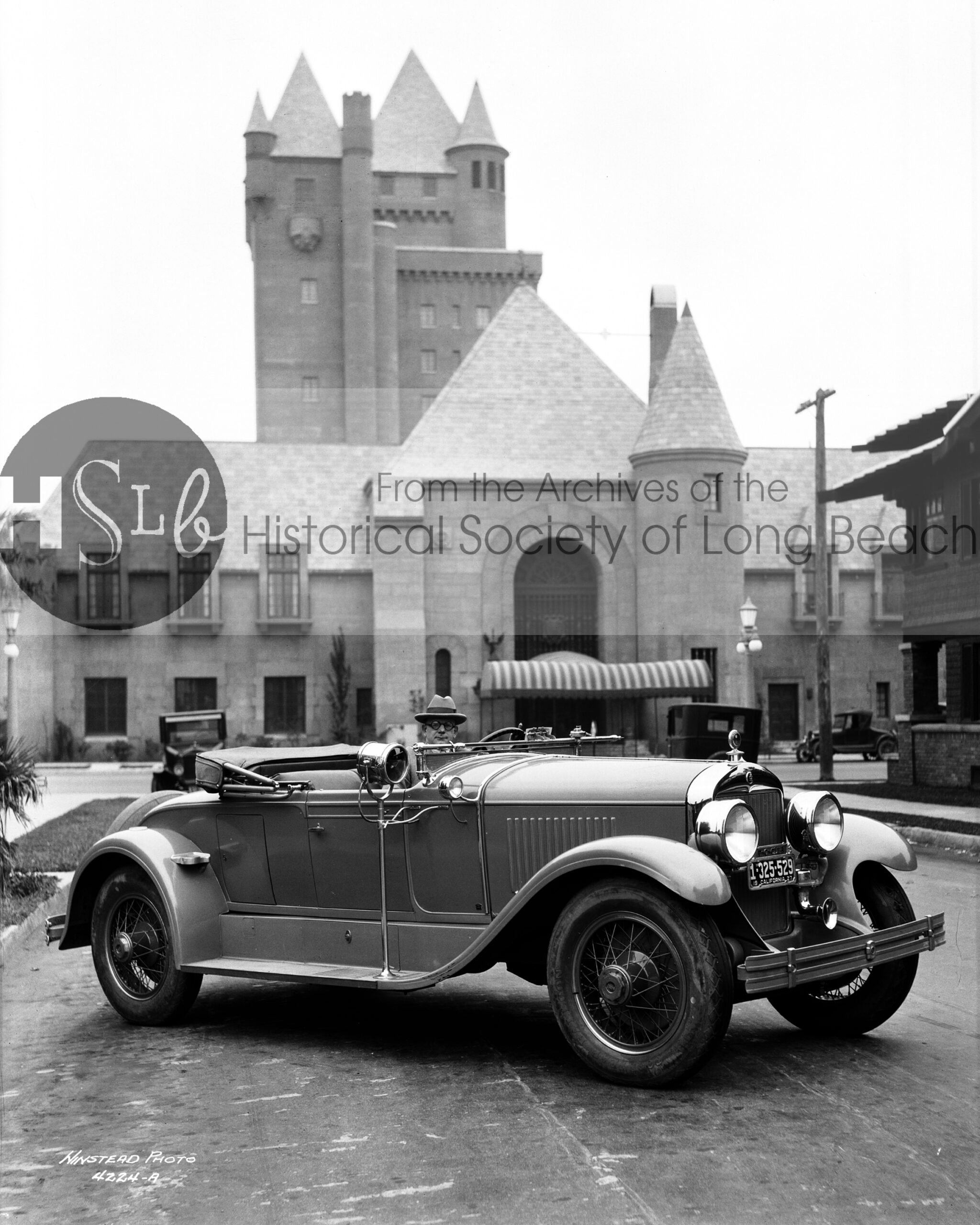 Parked in front of the Pacific Coast Club, 1927