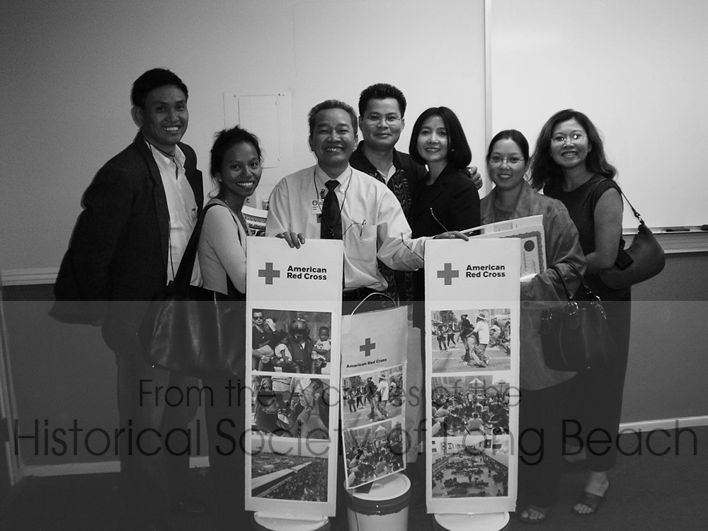 In 2005, shortly after Hurricane Katrina, a group of Long Beach Cambodian leaders came together to raise money for the Red Cross to help the victims. From left to right are Peter Long, Sophois Sokhom, Sweaty Chap, Richear San, Sithea San, (names unknown). They knew what it is was like to lose everything and have to start again and were moved to help. The group raised close to $20,000 for the Red Cross.