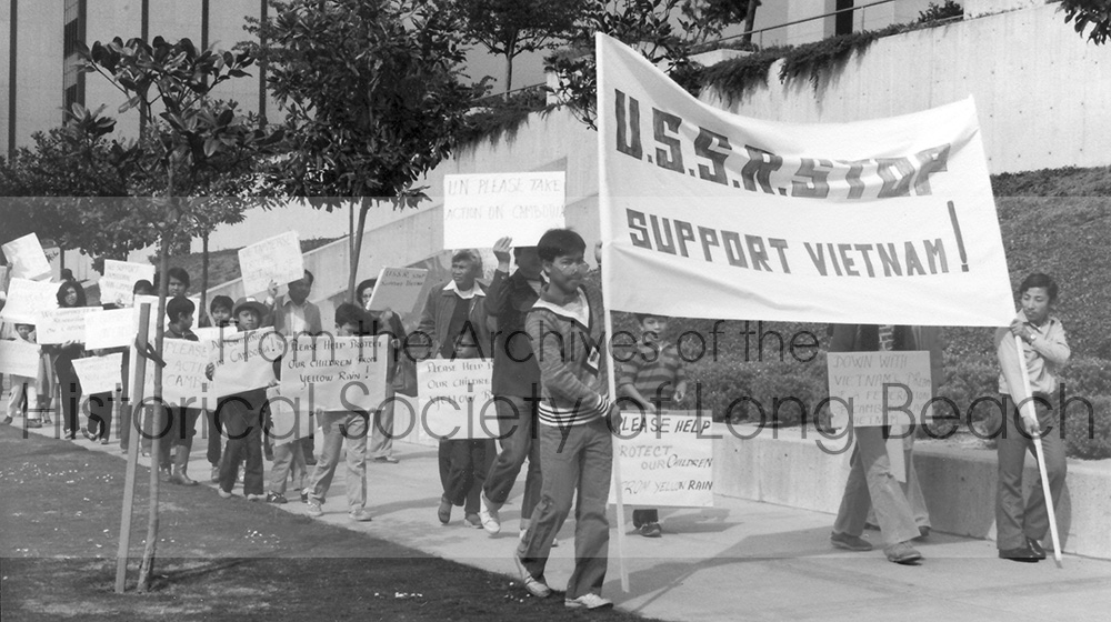 In 1979, Cambodians protested against Russian support of the Vietnamese in Cambodia. This picture shows the large crowd of Cambodian protesters marching in downtown Long Beach toward City Hall. The protest gained more prominence since Moscow was hosting the 1980 Olympics and Cambodian leaders used the anti-Communist sentiment to draw more public attention to the plight of Cambodian refugee issues.