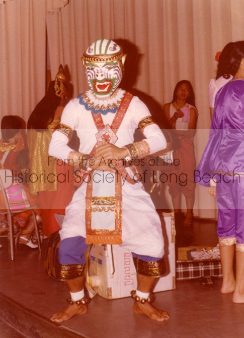 Pich Yon, dressed as Hanuman, the Monkey General from the epic Reamker story, prepares to perform at the 1976 New Year celebration in Long Beach, California. He crafted the handmade mask himself for the performance.