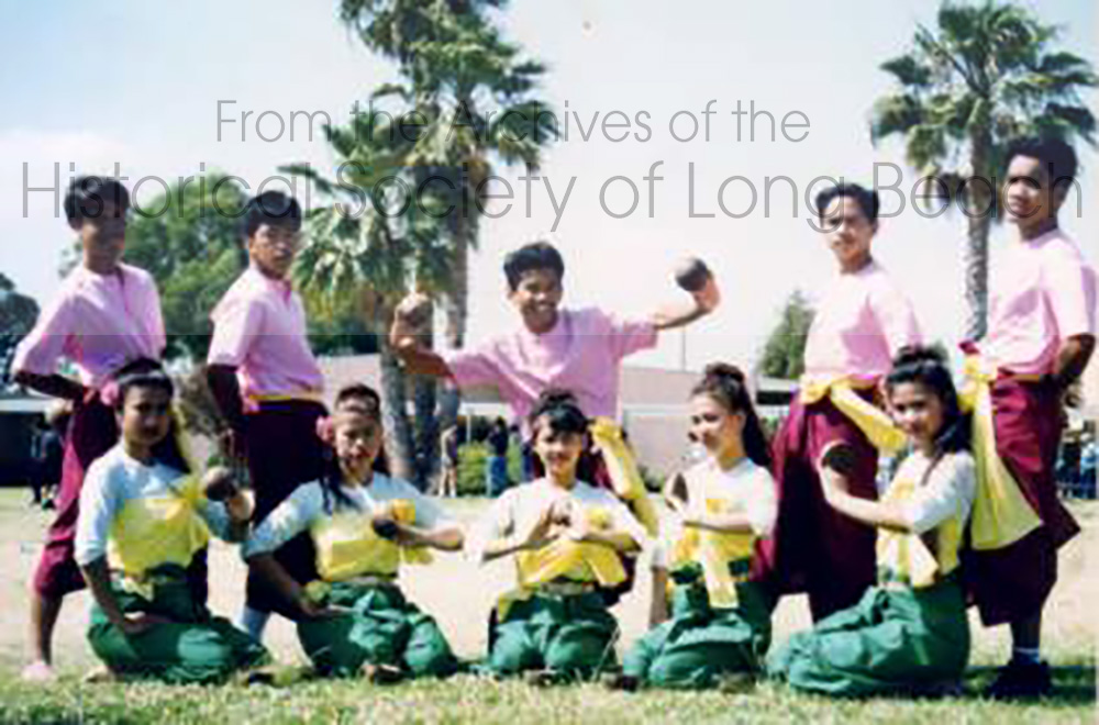 Dance troupe from Long Beach, California pose in traditional costume for the Coconut Dance.