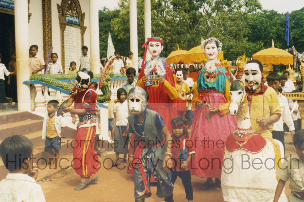 This photo, taken in Cambodia, shows the adventures of Hanuman, the monkey prince, and his role in helping Prince Rama rescue Princess Sita as part of the procession for Bun Khatin. The story is taken from the Reamker, the Cambodian version of the Ramayana. The Chhayam musicians are behind the performers.