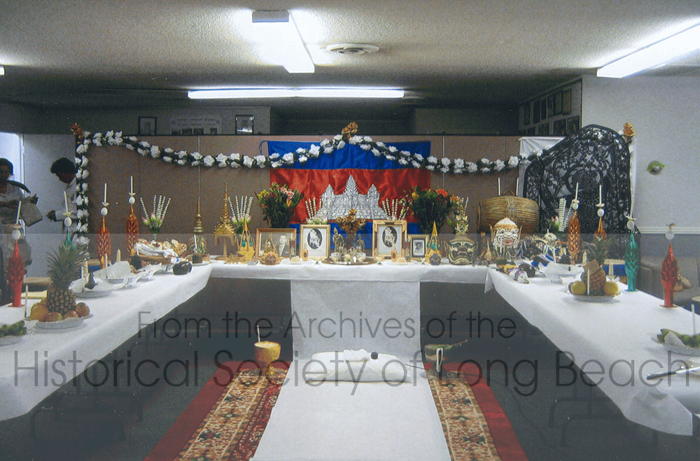 Altar for the Spirits of Khmer Angkor Sompeah Kruu Ceremony held at the offices of the Cambodian Association of America in Long Beach, on Thursday, November 23, 2006. Objects used in the dance and music, such as costumes, instruments, masks, a shadow puppet as well as photos of deceased teachers, and ceremonial objects, are placed on the altar to be thanked and blessed. Also included is food, flowers, and perfume.
