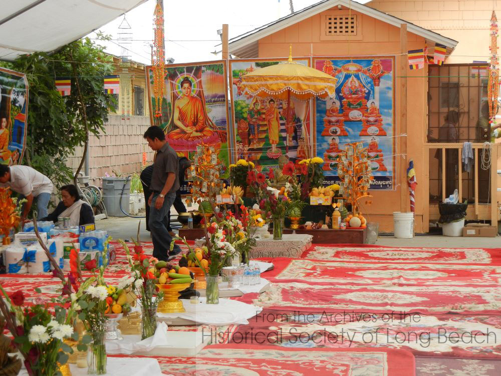 Preparing for a ceremony at Wat Orange, Long Beach, CA. The ceremony is being held outside because the temple is in a former house which is too small to accommodate all the visitors.