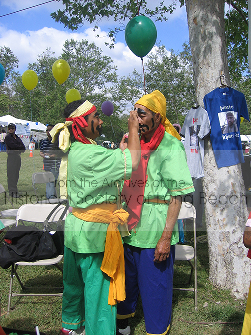 Two men prepare to perform Chhayam, a lively call and response dance performance using primarily percussion instruments.