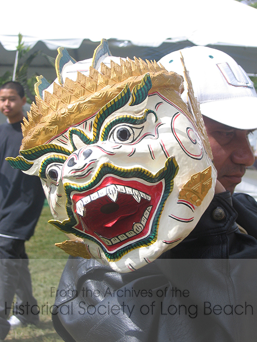 Cambodian New Year celebrations in Long Beach include performances of traditional dance and music. This photo is a close up of a Hanuman mask, the Monkey King of the epic poem, Ramayana (known as Riemke in Khmer). The story tells of the banishment, travels, and return of Prince Rama and his wife Sida. Hanuman gathers all the monkeys to help Prince Rama rescue his wife Sida from Ravana. Originating in India, the Ramayana is now found throughout Southeast Asia.