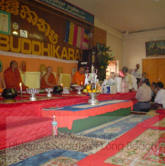 2003 Pchum Ben observance at Wat Willow in Long Beach, CA. Each family brings offerings of food, water, rice, and money to the monks to be blessed. The merit of the offerings is transmitted to the family's ancestors through the monks.