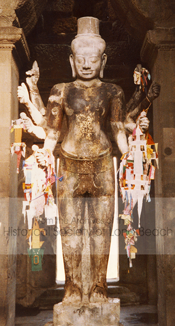 This giant statue of the divine Hindu god Vishnu known as Ta Reach is located inside the West Gate of Angkor Wat. Considered one of the most powerful local spirits or Neak Ta, the statue is cared for and offerings are made by Cambodians (and visitors) for blessings and to alleviate worries. (Photo courtesy of Bonnie Lowenthal)