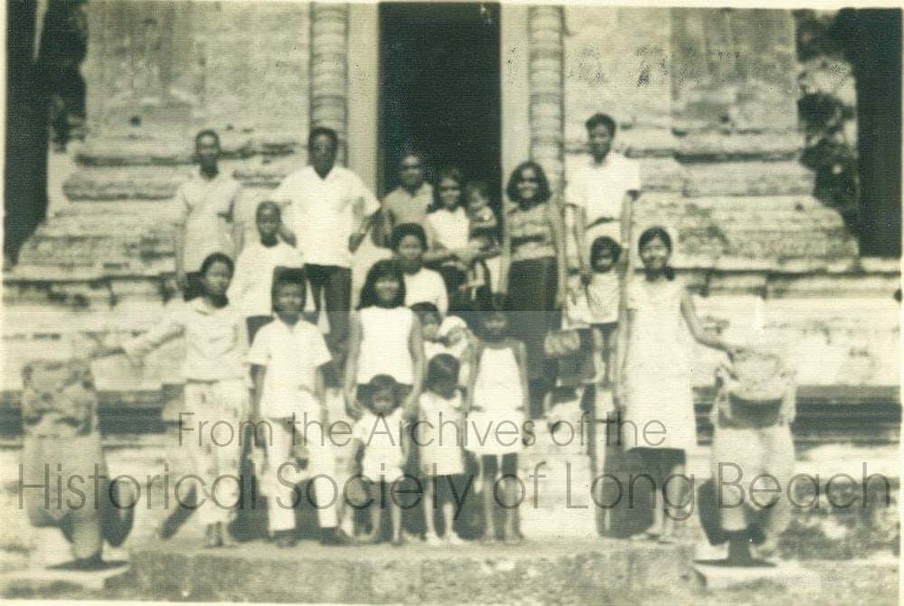 Bokanika Kan’s mother and father, Borin and Bo Kan, (back row at right) with extended family Angkor Wat before Bokanika was born c. 1960.