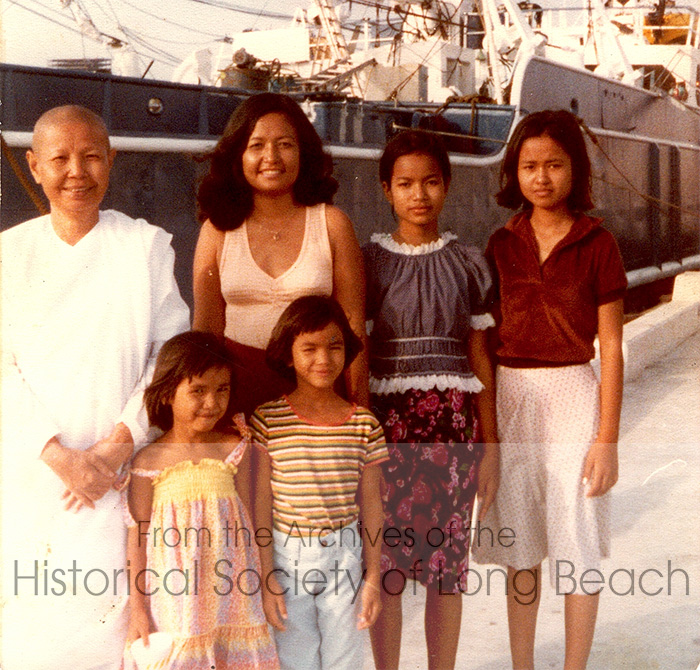 Bokanika Kan’s family in San Diego, CA c. 1980. Back row, left to right: Bokanika’s maternal grandmother, Sieng Torng; her mother, Borin Kan; and her sisters, Lyane Kan and Min Kan. Front row, left to right: Bokanika and her sister, Emery.