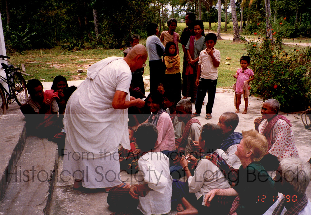 Bokanika Kan’s maternal grandmother, Sieng Torng, with a group of children and elders at a Buddhist temple. Occasion unknown. December 14, 2023.