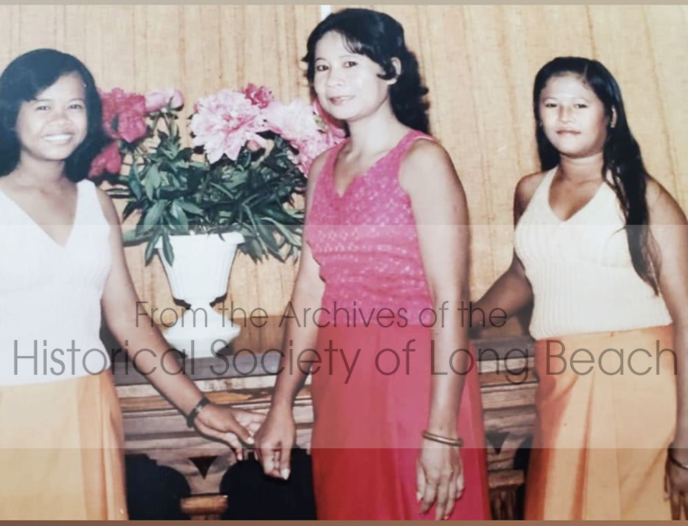 Left to right: Bonavy Som, her mother, Naly Men, and her older sister, Bony. They had been sponsored by The Sisters of Mary of the Presentation, a convent in Valley City, North Dakota. This photo was taken at the welcome dinner. 1981.