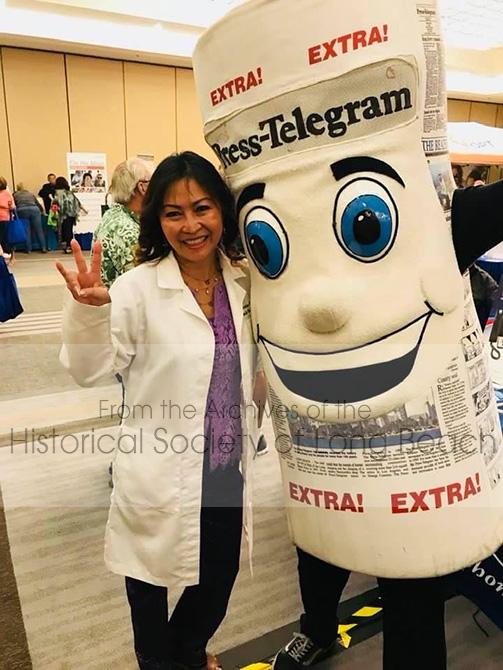 Dr. Christina Lee with the Press Telegram mascot at the Golden Future 50+ Senior Expo where she had a booth. Long Beach, CA 2018.
