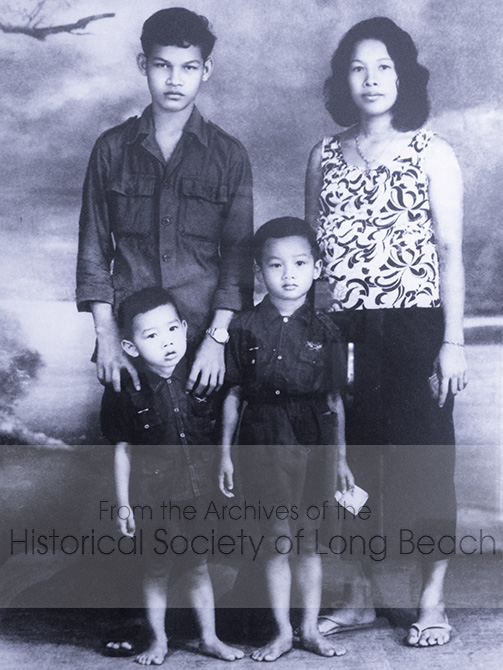 Clark Tang’s uncle, Bunpa Ung, with Clark’s mother, Clair Ung with Clark (left, approx. 2-3 yrs old) and his older brother Shane Pen, (right, 4-5 yrs old). The photo was taken in a studio in Ta Khmao, Cambodia in 1971. The uncle is now a heart surgeon in Switzerland and has three children. The photos were buried in the ground and a family member went back after the war to dig them up.