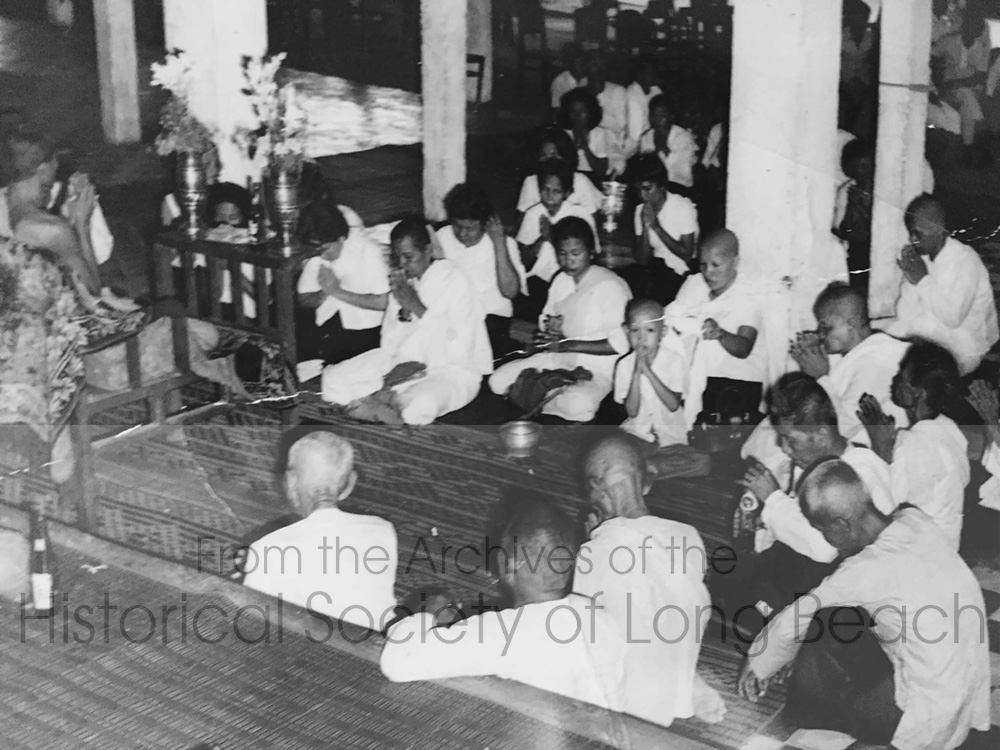 Funeral of Clark Tang’s grandfather, Cheark Ung, at a temple in Phnom Penh, Cambodia 1974. Clark is the child at the center of the photo.