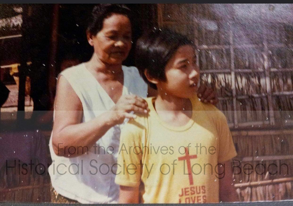Clark Tang and his maternal grandmother, You Long, at the Khao-I-Dang refugee camp in Thailand, c. 1980. She adopted Clark when he was 1 or 2 years old and cared for him as a son (NOTE: in Cambodia it is not uncommon for a family member to become the primary caregiver of an extended family member even if their nuclear family is still living) . His grandmother lost many family members, including three sons, during the Khmer Rouge period. After the Vietnamese entered Cambodia in 1979, she wanted to leave the country. Clark’s mother and father wanted to stay, so, he went with his grandmother to the refugee camps in Thailand.