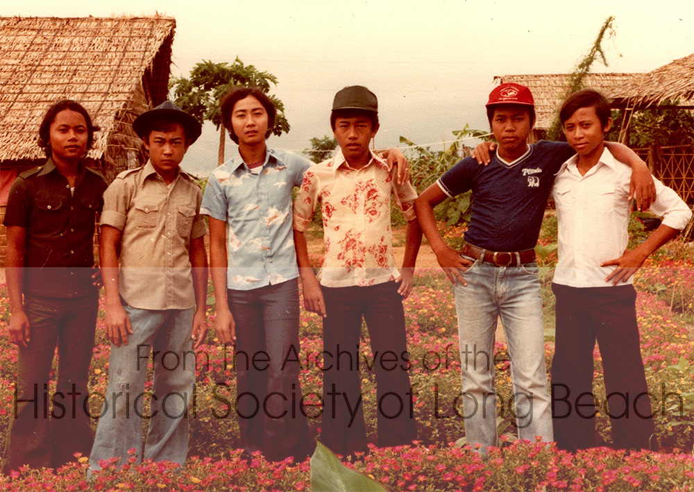 Dan Durke with friends from the orphanage at the Khao-I-Dang refugee camp in Thailand c. 1981. From left to right: To, Dan Durke, Prak, and Wan. He doesn’t remember the names of the two on the right. In 2021 Dan posted the photo on FaceBook to see if he could find any of them. To lives in Canada, Prak lives in Buena Park and Wan is a police officer in Lynne, MA.