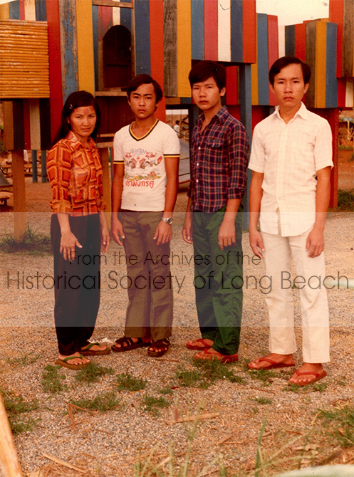 Dan Durke (2nd from left in white t-shirt) is pictured in the Khao-I-Dang refugee camp in Thailand with three distant relatives who escaped with him to Thailand, c. 1982. The group had pooled their money to hire someone to guide them safely through the mine-infested jungle to the Thai border. From left to right: Hun, Dan Durke, Klong, and Ly. Note the three red circles on Hun’s forehead. These circles result from a traditional treatment for illness, known as “chub” (cupping). Dan stayed in touch with Klong who lived in Stockton and worked as a truck driver. Hun has since passed away.