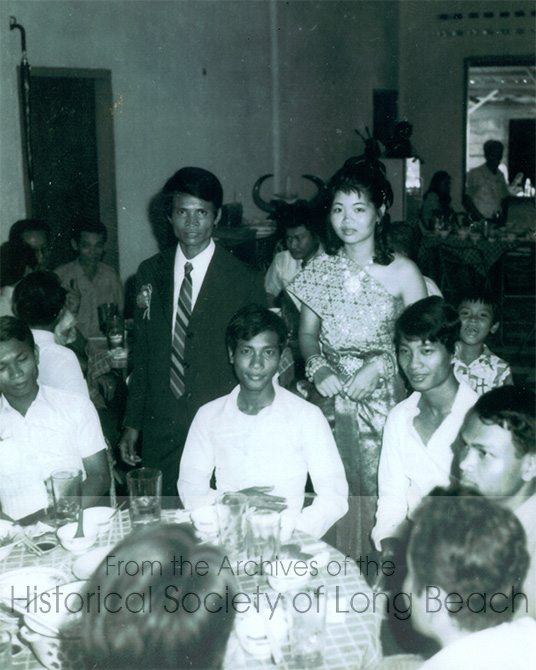 Danielle Khim’s Father, Khun Cheng (seated, center front, looking at the camera), at the wedding of a first cousin in Phnom Penh, Cambodia c. 1970. Other people are relatives but their names are not known. This is the only photo Danielle has of her father which she received from her aunt. Most of Danielle’s memories of her father were from her mother.