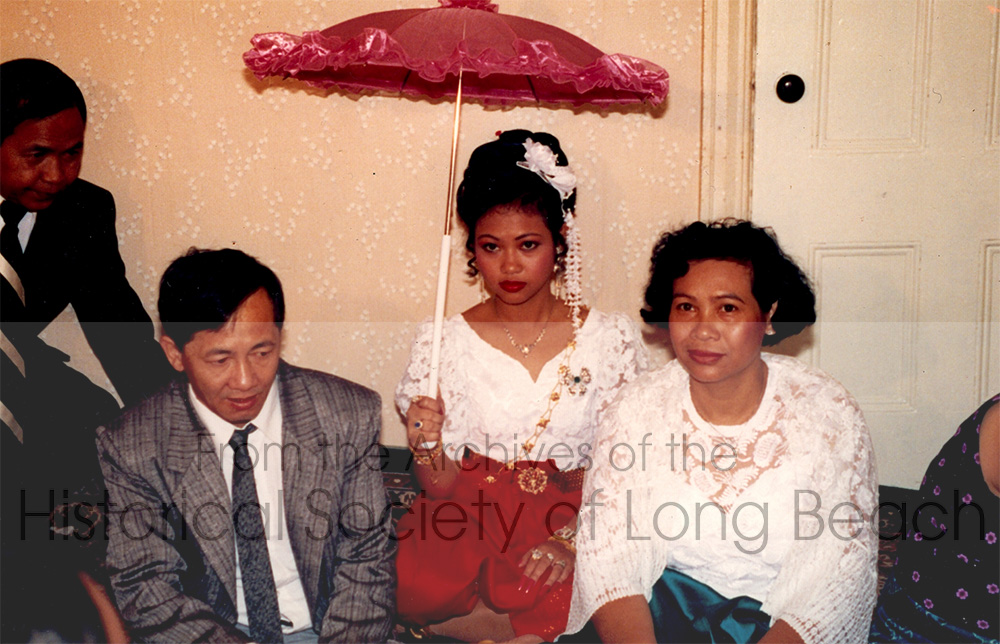 Danielle Khim’s wedding photo (center, holding the umbrella) with her parents in Providence, Rhode Island, 1991.