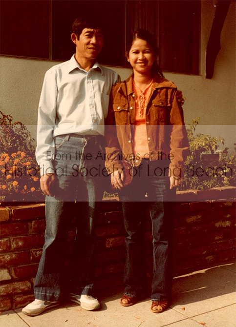 Monorom Neth’s uncle, Chum Ouch, and his wife, Vorn Om, standing in front of their home in Norwalk, CA, 1983. Chum Ouch sponsored Monorom’s family to the U.S. Two families (approx. 16 people) lived there and shared one car.