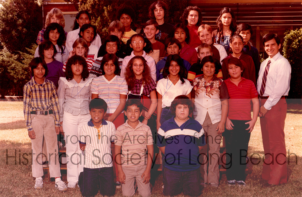 Monorom Neth’s class picture of perhaps the 7th grade at Nuffler Elementary School in Norwalk, CA 1983. He is standing at the far left of the first row in the plaid shirt and was probably 12 years old. His teacher, to the far right, was Mr. Roman. Monorom remembers being bullied by some classmates. He did not stay in touch with any of them after his family moved.