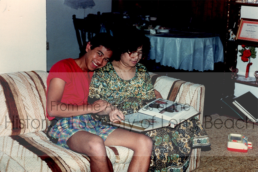Monorom Neth’s mother, Om Van, and Monorom sitting on the couch, spending time together. He was probably 15 years old. Photo was taken in Bellflower, CA 1986.