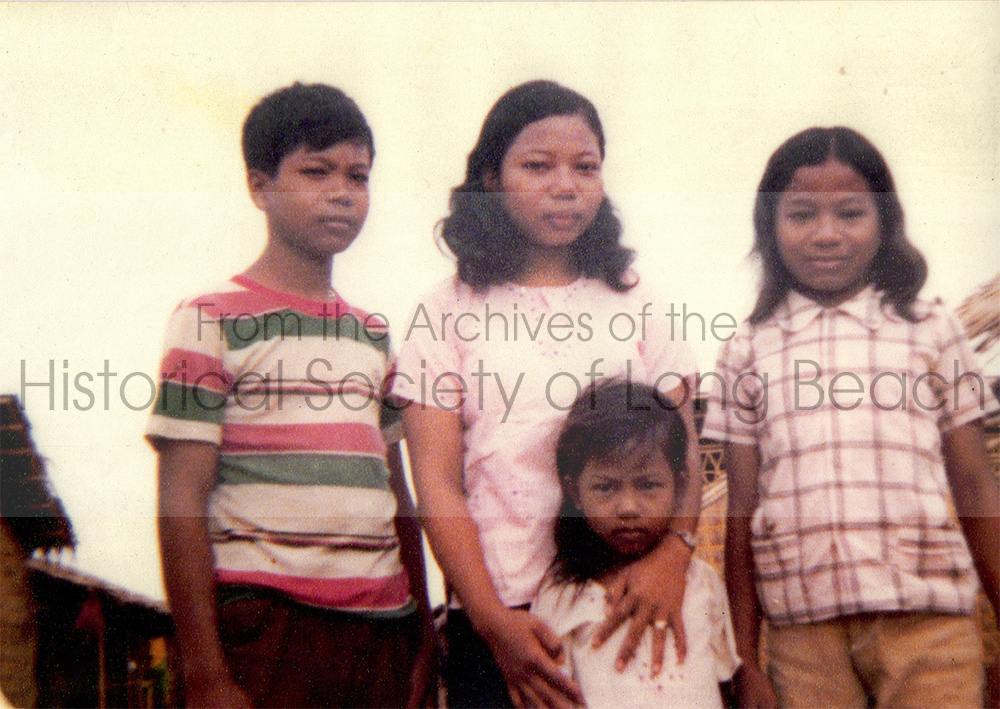 Namoch Sokhom (left) with his sisters, Namom Sokhom, Sovathana Sokhom, and the youngest in front, Sophois Sokhom. Khao-I-Dang refugee camp in Thailand 1979.