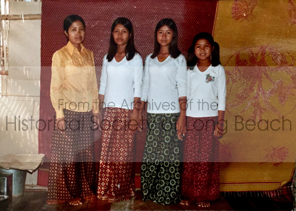 Yi family in their room at the Kampot Refugee Center in Thailand, 1981. Mats were hung as walls to separate the area into rooms. From left to right are Sithy’s mother, San Thi Tran; Sithy; her sister, Sithea; and Sitheavy. Sithy was about 12 or 13 at the time. Her mother hired a photographer so they could send photos to an uncle in the U.S. and family members in Vietnam letting them know they were alive.