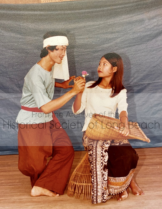 Sithy Yi performing the Fishing folkdance with Chhean Sreng Ngive at the Khao-I-Dang refugee camp in Thailand, in 1981. In the Fishing dance boys flirt with girls who are busy gathering fish for their family’s dinner. The basket Sithy is holding is designed to catch a specific kind of fish along the shore. Sithy and the other dancers in the group have stayed in touch over the years. There were about fifty who are now living in Belgium, France, Cambodia, Australia and the U.S. Chhean lives in Minnesota.