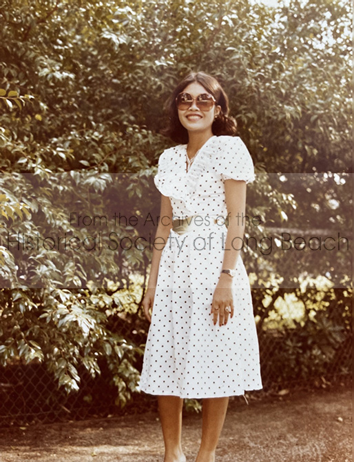Sithy Yi, Long Beach, CA 1984. Sithy is a talented seamstress. She made clothes for the whole family in the refugee camps and their early days in Long Beach. The dress she is wearing is an example of her talent.