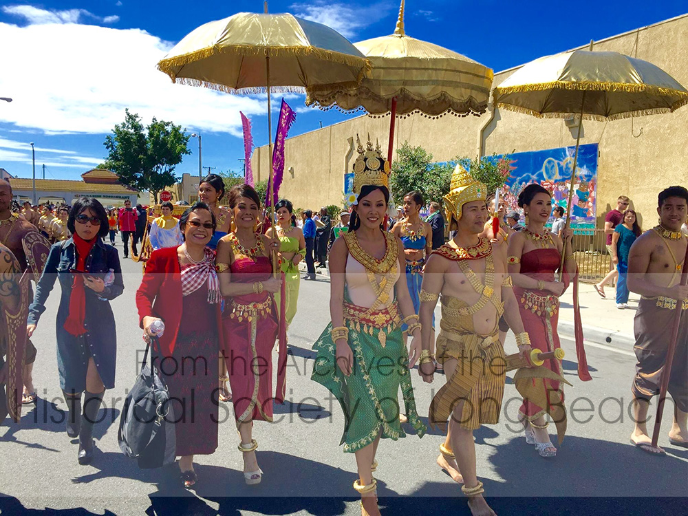 Sithy Yi (3rd from left in red) walking in the 2016 Cambodia Town Parade and Culture Festival held each April in celebration of Cambodian New Year. From left to right: Sithy’s sister, Sitheavy Yi (Jennifer Diep); Nanda Pok; Sithy Yi; Sithy’s daughter, Lauren Thor (as the queen); Sithea’s brother-in-law, Paul San; Sithea’s sister-in-law, Vanna (last name unidentified); and Sithy’s son, Lucas Nguyen. The entire family is involved in this annual; community event.