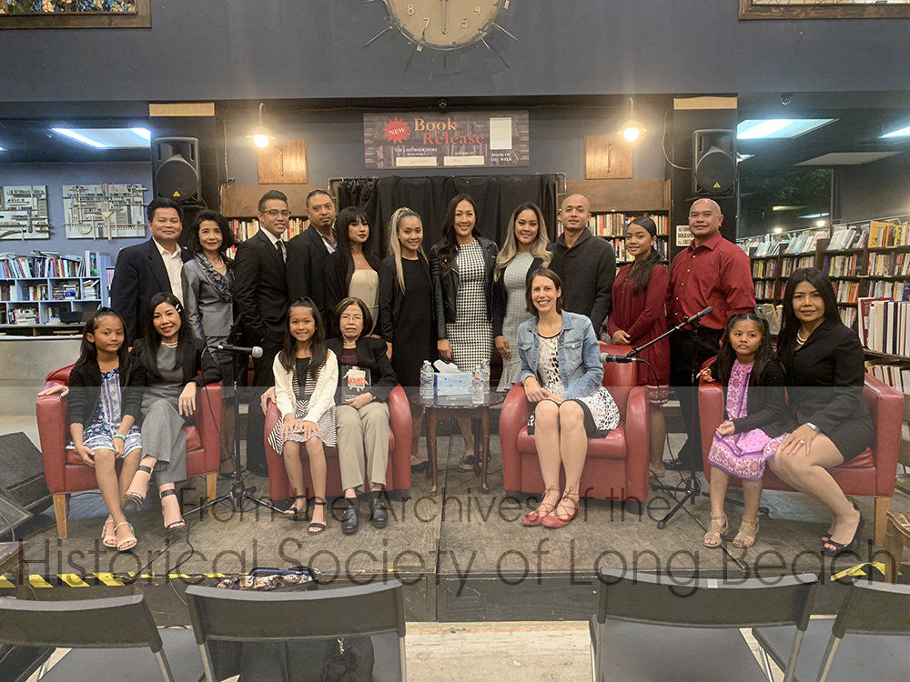 Sithy and her family at the book launch of Exiled – From the Killing Fields of Cambodia and Back, by Katya Cengel, Los Angeles, CA, November 1, 2018. Sithy’s story as a survivor of genocide, refugee, and possible deporttee, is told in this book. Back row, left to right: Richer San (brother-in-law); Sithea San (sister); Lucas Nguyen (son); Ben (daughter Paulina’s boyfriend); Paulina Chea (daughter); Loris Thor (daughter); Laurel Thor (daughter); Dy Heng, (daughter, Lauren’s boyfriend) Jocelyn Heng (daughter), Kim Chheang (Sithy’s boyfriend). Front row left to right: Madelyn Heng (granddaughter); Lauren Thor (daughter); Kaliya Kuy (granddaughter); San Thi Tran (Sithy’s mother); Katya Cengel (author); Makayla Heng (granddaughter); Sithy Yi.