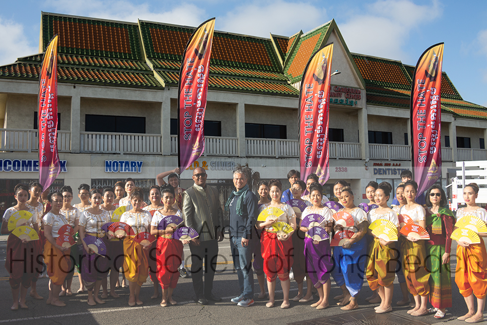 Sithy Yi with the Stop The Hate with Love dance troupe waiting on Anaheim Street in Long Beach, CA to march in 2023 Cambodia Town Parade and Culture Festival, April 22, 2023. With the troupe is Long Beach Mayor, Rex Richardson (center in green jacket) and California State Attorney General, Rob Bonta (center in blue). Sithy is standing to the left of Mayor Richardson. Sithy’s sister, Sithea San, is second from the right in the front row wearing sunglasses. Sithea is President of the Cambodia Town Board and one of the coordinators for the event.