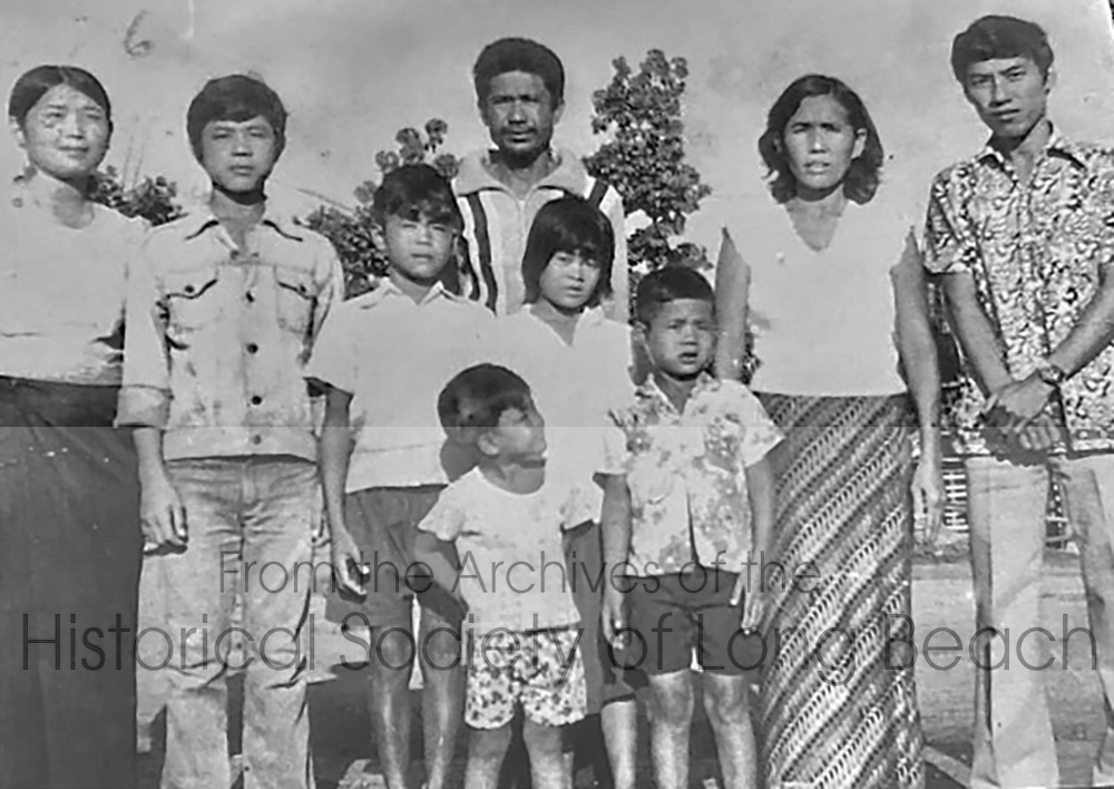 Sophy Khut’s family at the Surin refugee camp in Thailand in 1976. Back row, left to right: Sophy’s sister, Sopha; brother, Sokheng; Sophy's father, Kheam Khut; mother, Sophea Khim; and brother-in-law, Nguon Lem. Middle row, left to right are Sophy’s brother Sophal, Sophy, and younger brother, Sophat. The youngest brother, Chetra, is standing in front of Sophy. They were at the Surin camp for six months.