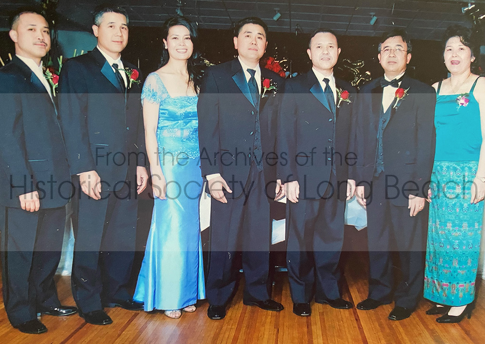 Sophy Khut (center) with her siblings at Sophat Khut’s wedding in Portland, OR in 2006. From left to right: Chetra, Sophat, Sophy, Sophal, Sokheng, Sakhenn, and Sopha Lem.