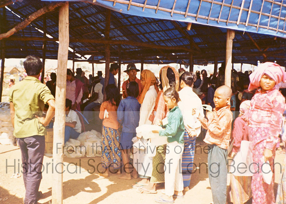 Cambodian refugees along the Thai-Cambodia border wait in line for food (1982). (David Kreng Collection)